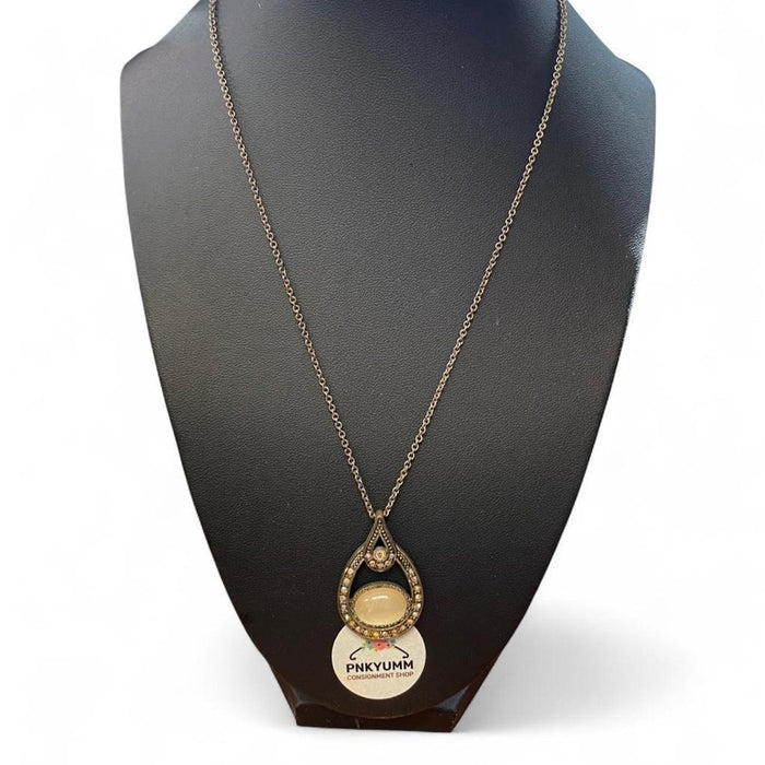 Gold and cream necklace with