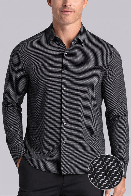Model wearing the Ascent Black White micro geo print long sleeve shirt, styled with fitted black dress slacks.