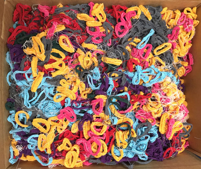 Colorful Sock Loopers Various packed together in a cardboard box
