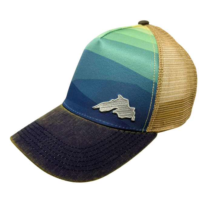 Trucker Hat with blue ombre front panel and a small silver Lake Superior patch.