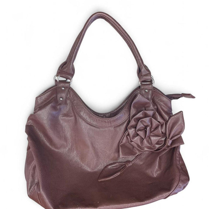 Brown leather handbag with flower
