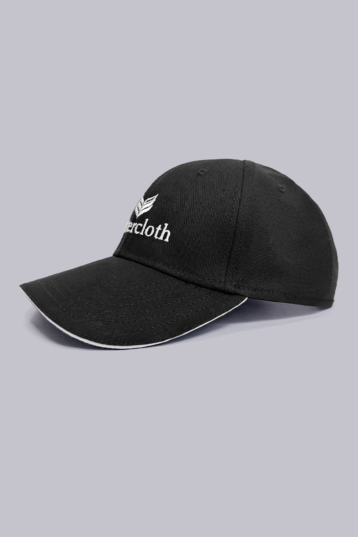 Model wearing the sleek Black Buttercloth Hat cap comfortable headwear.