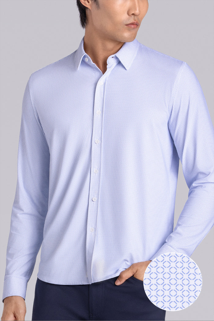 Model wearing the Captivate White Blue long sleeve dress shirt, styled with fitted black dress slacks.
