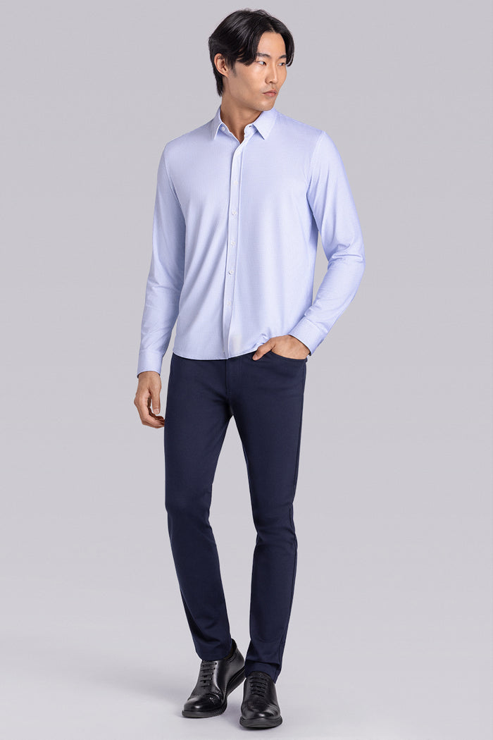 Model wearing the Captivate White Blue long sleeve dress shirt, styled with fitted black dress slacks.