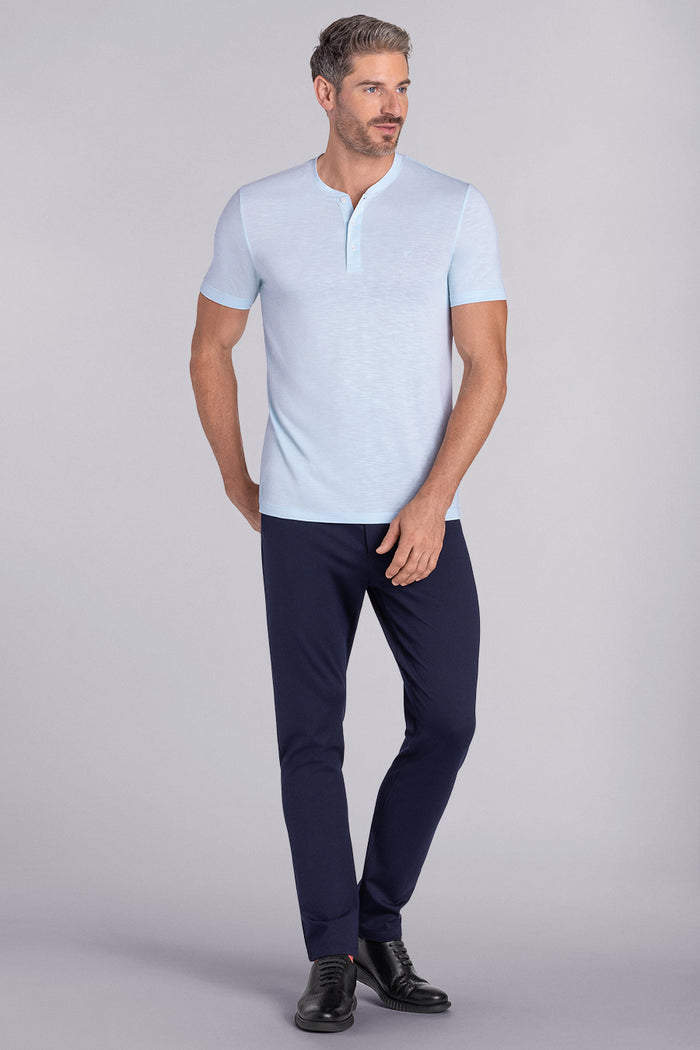 Model wearing Cardinal Country Air soft short sleeve shirt, styled with fitted black pants