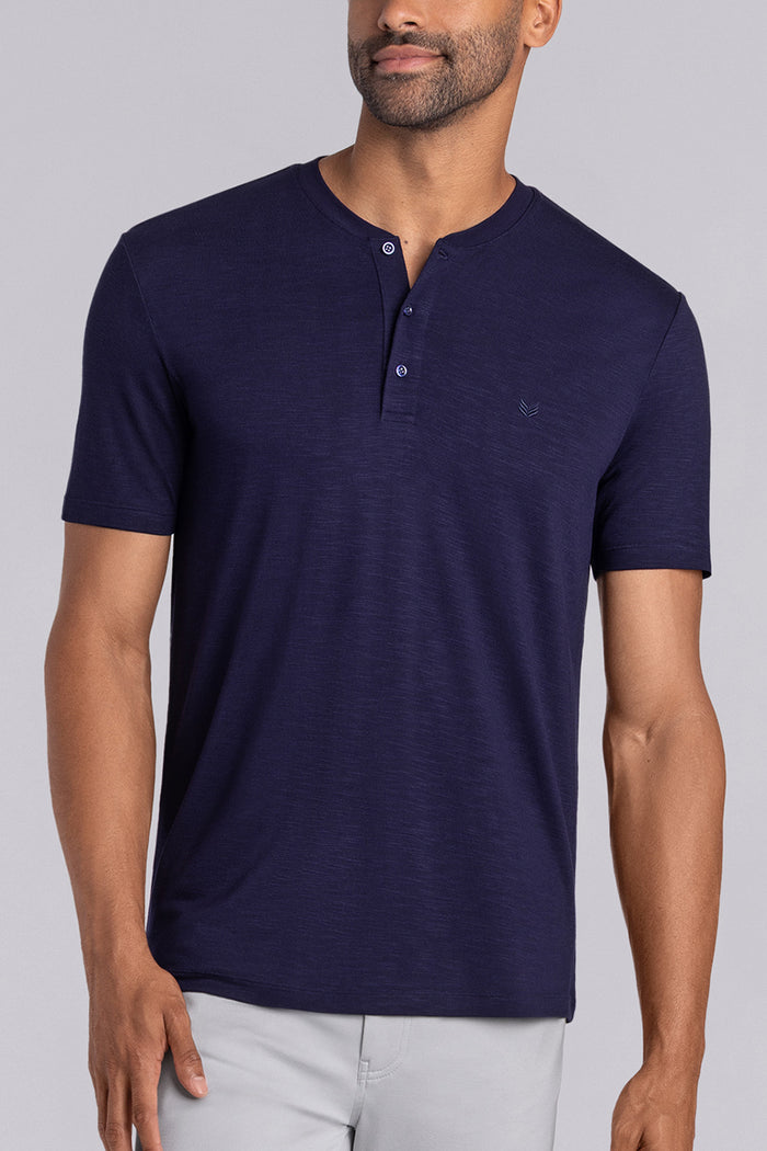 Model wearing Cardinal Navy soft short sleeve shirt, styled with fitted light grey pants