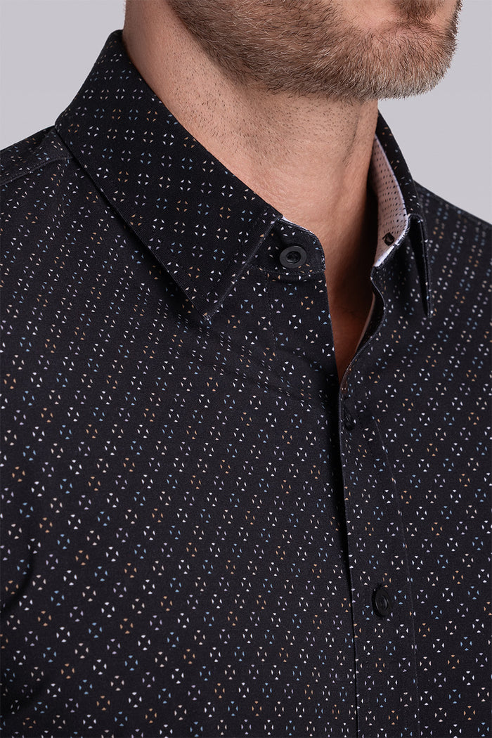 Model wearing the Cerebral Black long sleeve dress shirt, styled with fitted black dress slacks.
