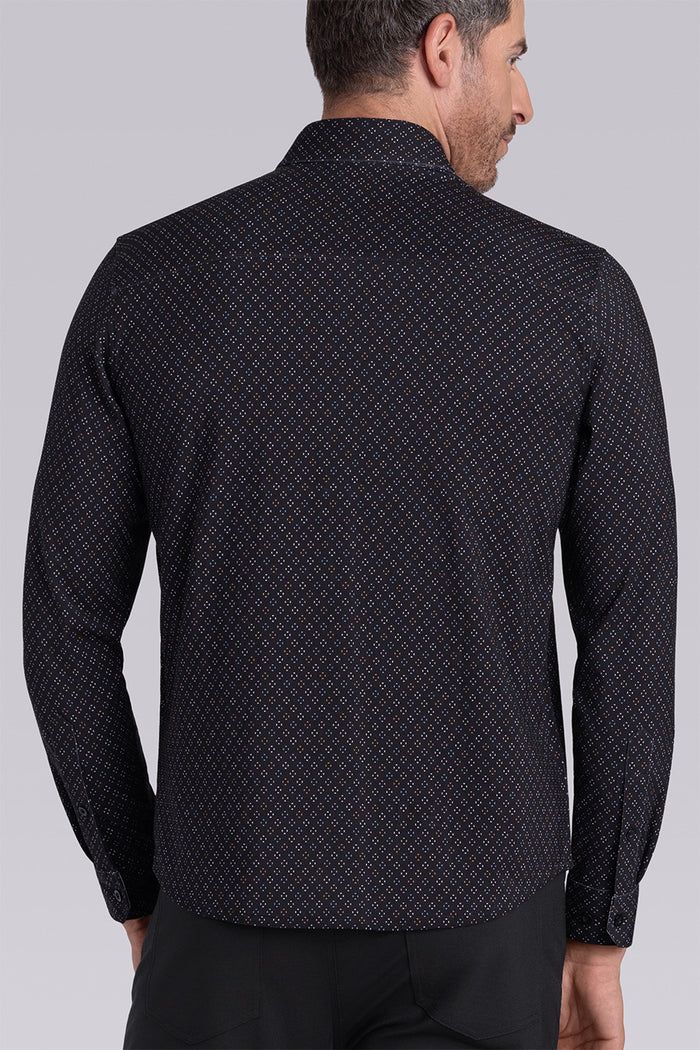 Model wearing the Cerebral Black long sleeve dress shirt, styled with fitted black dress slacks.