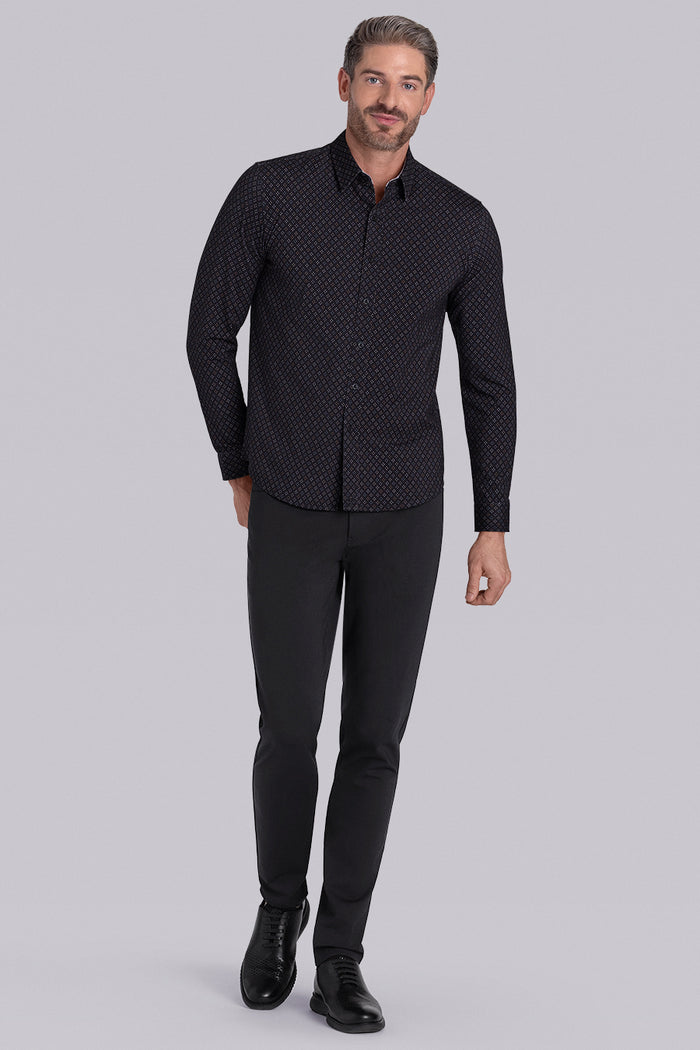 Model wearing the Cerebral Black long sleeve dress shirt, styled with fitted black dress slacks.