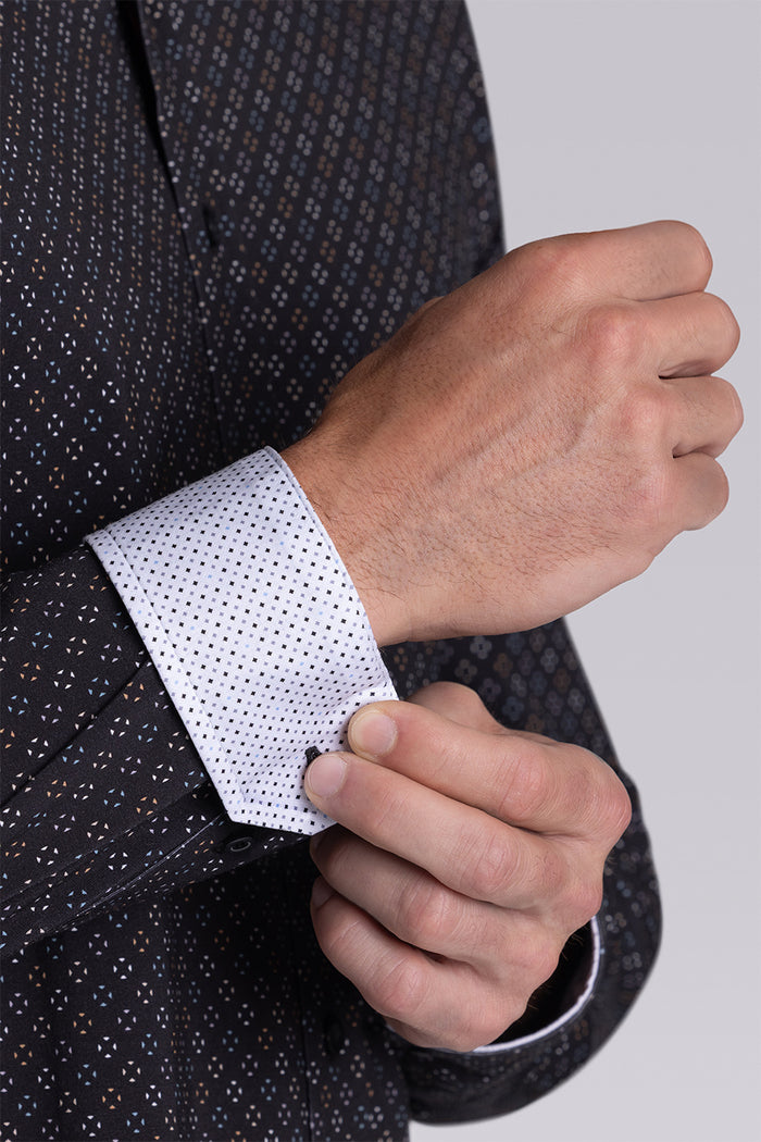 Model wearing the Cerebral Black long sleeve dress shirt, styled with fitted black dress slacks.