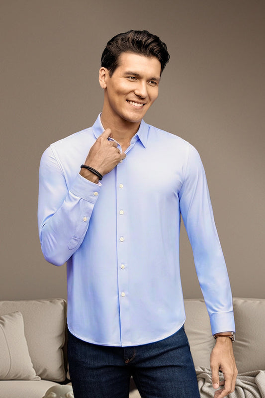 Model wearing the Crowd Pleaser Light Blue long sleeve shirt, styled with black pants.