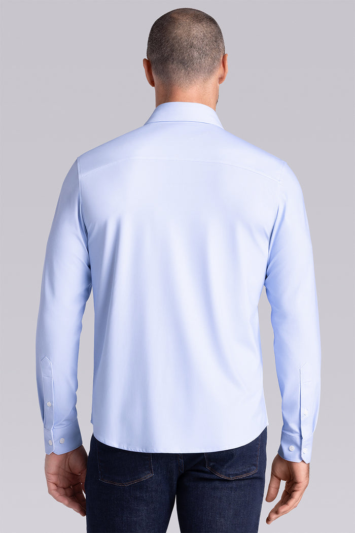 Model wearing the Crowd Pleaser Light Blue long sleeve shirt, styled with black pants.