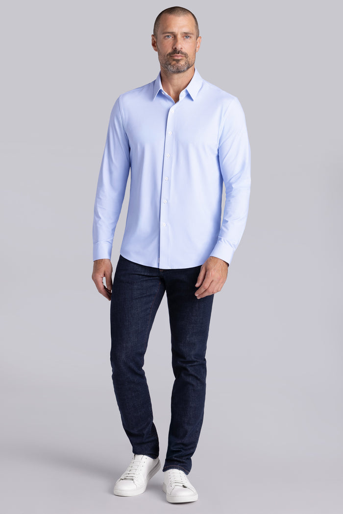 Model wearing the Crowd Pleaser Light Blue long sleeve shirt, styled with black pants.