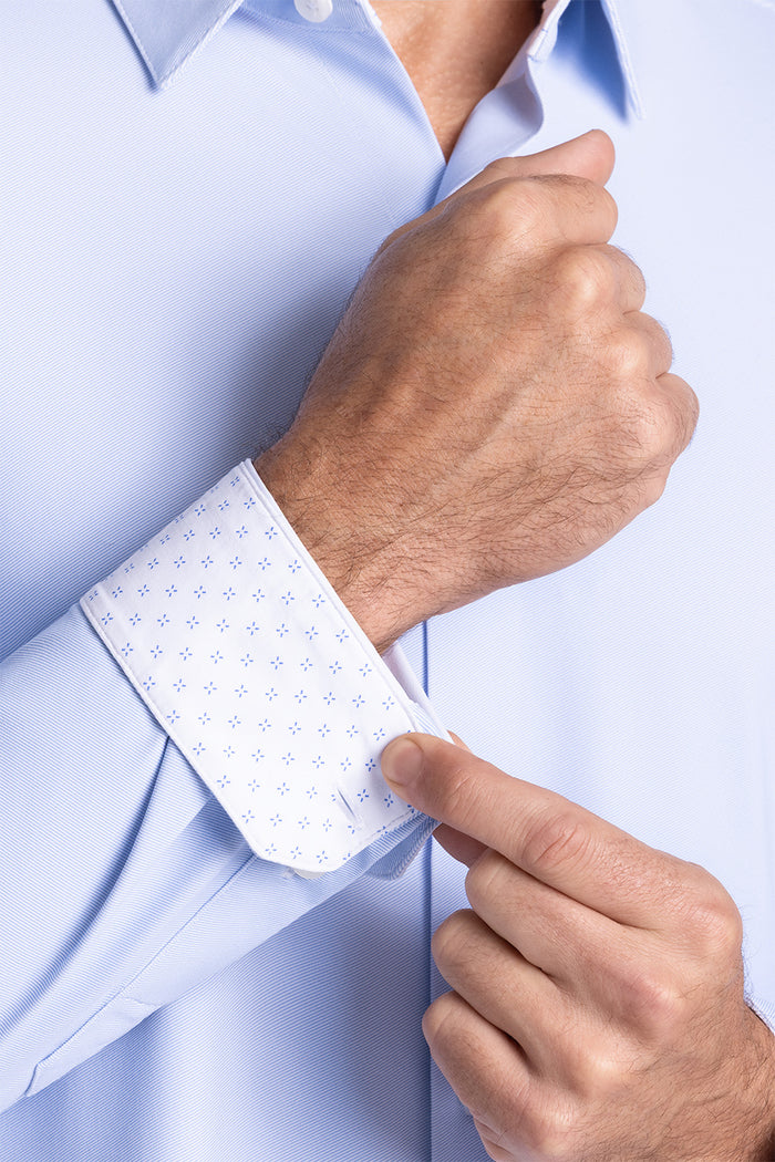 Model wearing the Crowd Pleaser Light Blue long sleeve shirt, styled with black pants.