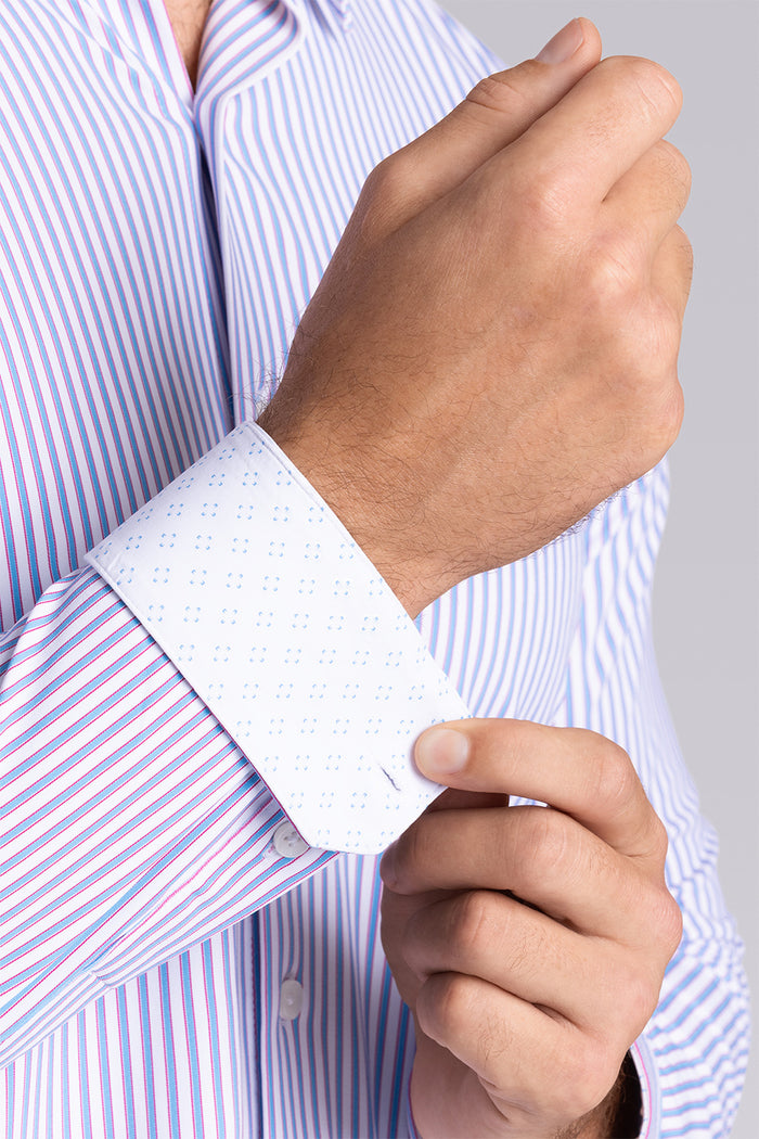 Model wearing the Crowd Pleaser White Blue long sleeve shirt, styled with black pants.