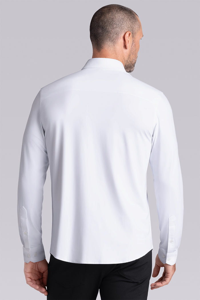 Model wearing the Crowd Pleaser White long sleeve shirt, styled with black pants.