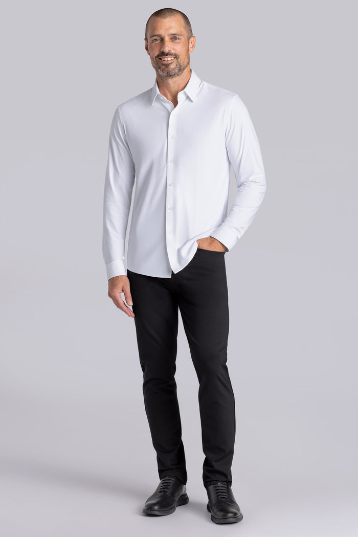 Model wearing the Crowd Pleaser White long sleeve shirt, styled with black pants.