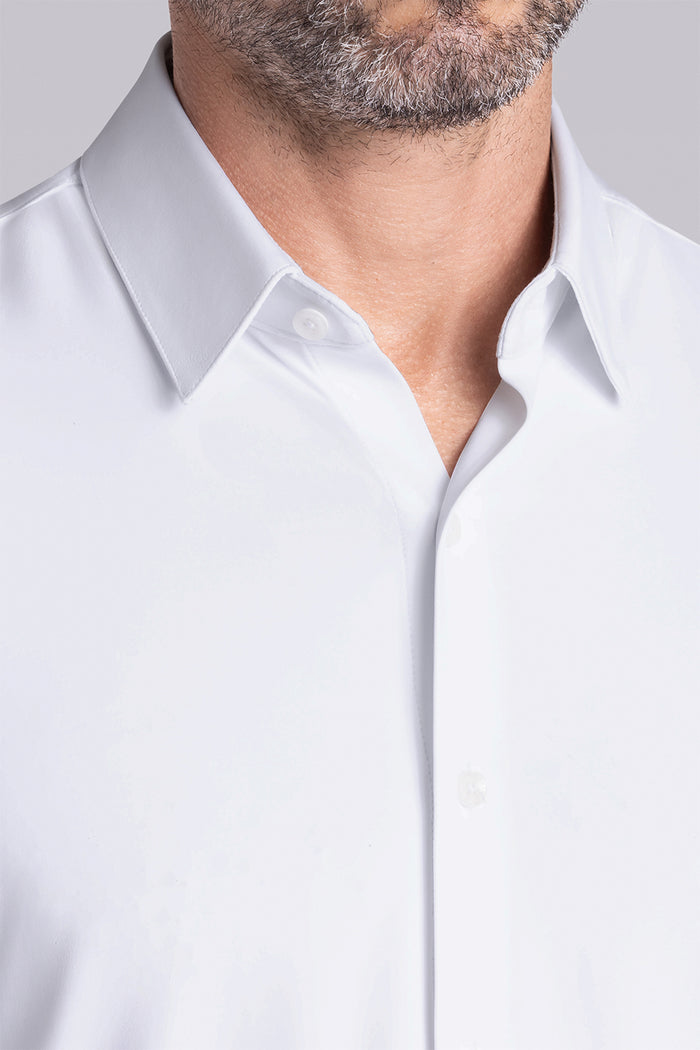 Model wearing the Crowd Pleaser White long sleeve shirt, styled with black pants.