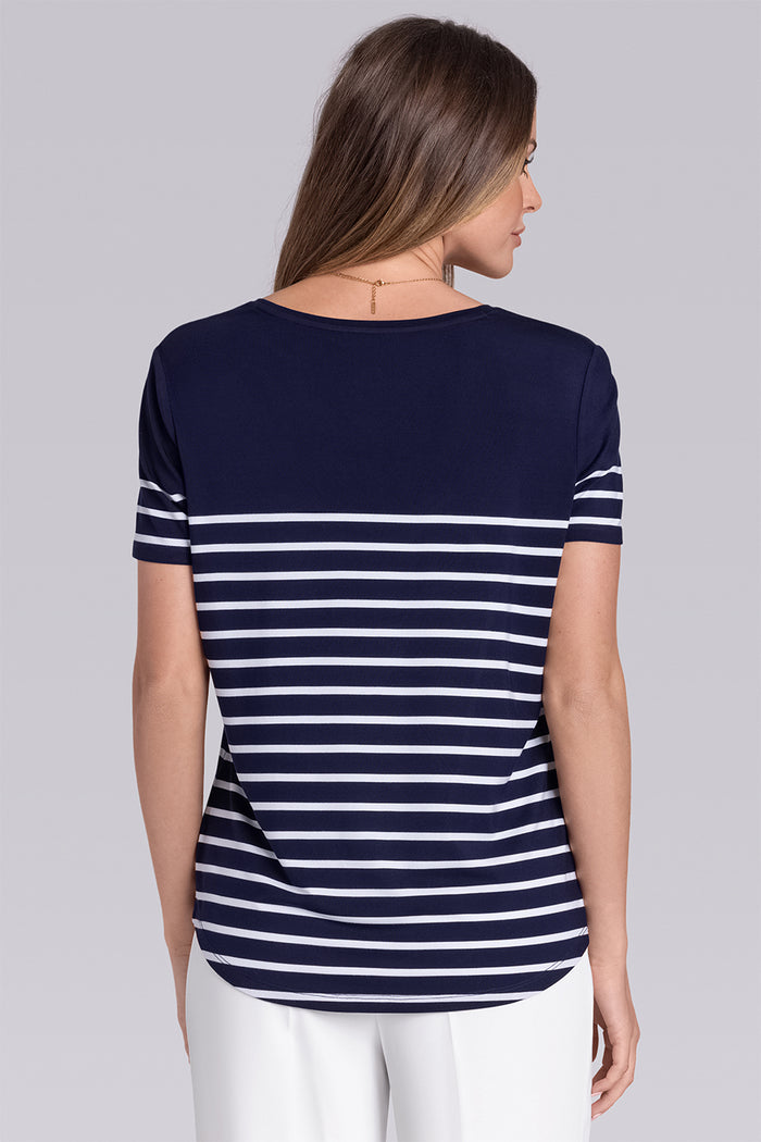 Model wearing the Daydream Deep Sea Blue White scoop neck stripped short sleeve tee, styled with white pants