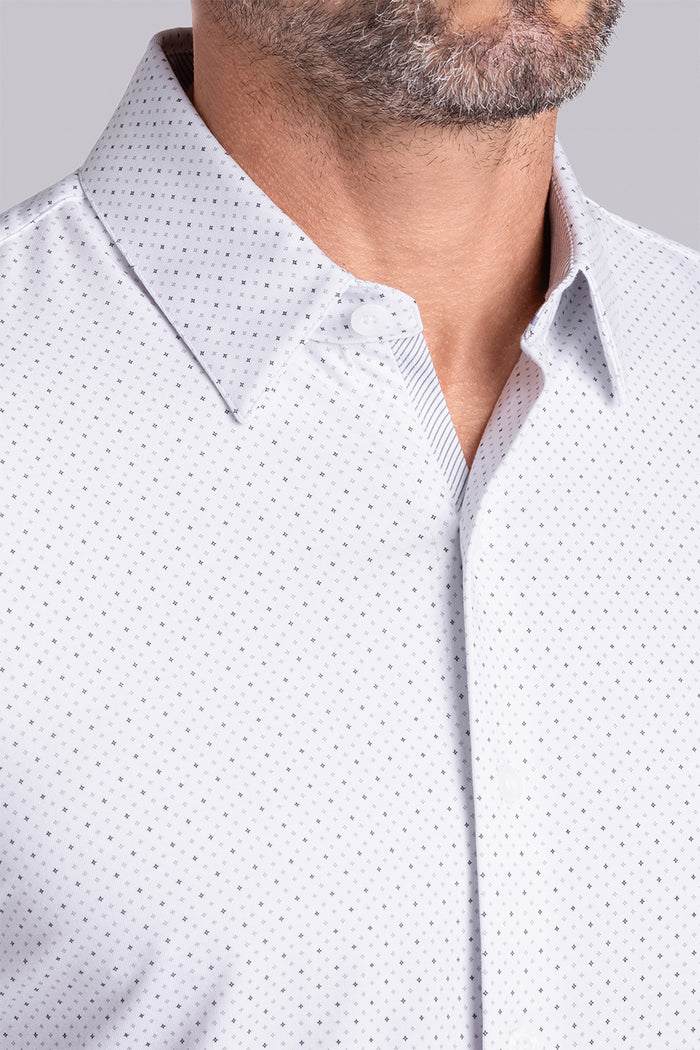 Model wearing the Dignity White long sleeve shirt, styled with black pants.