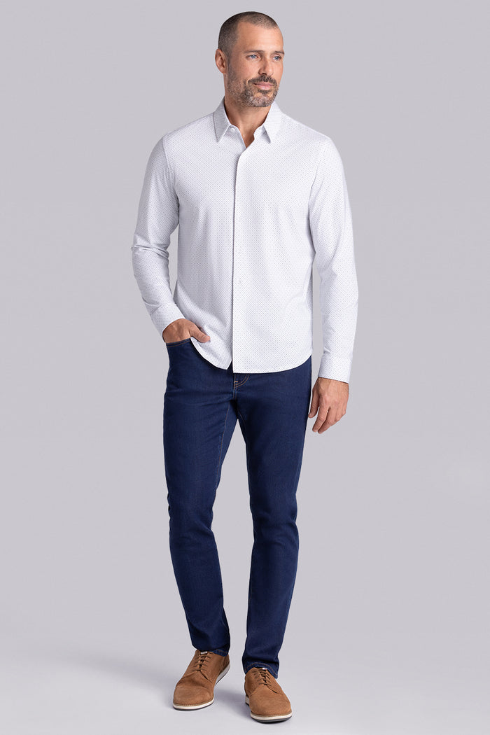 Model wearing the Dignity White long sleeve shirt, styled with black pants.