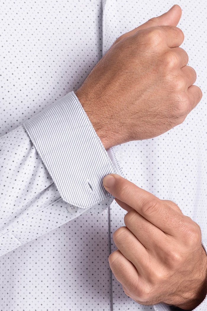Model wearing the Dignity White long sleeve shirt, styled with black pants.
