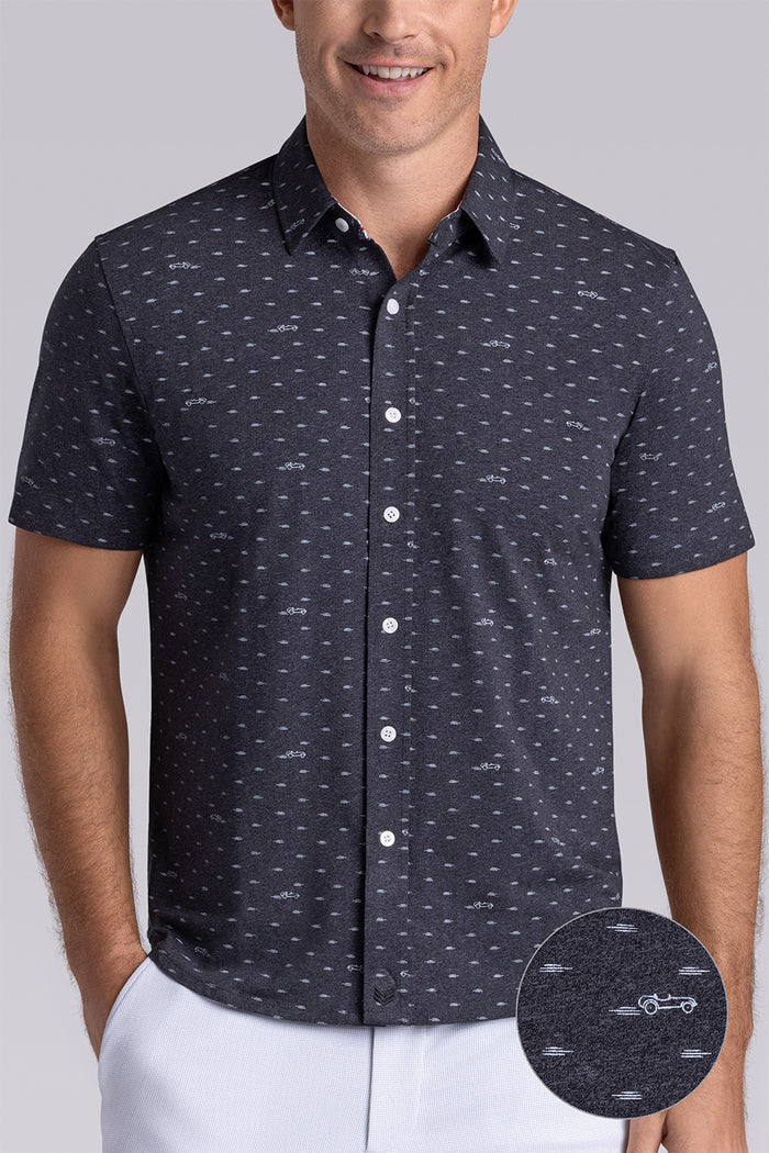 Model wearing Drift Charcoal Heather short sleeve car print shirt, styled with white shorts