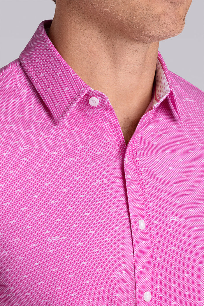 Model wearing Drift Fuchsia Red short sleeve car print shirt, styled with white shorts