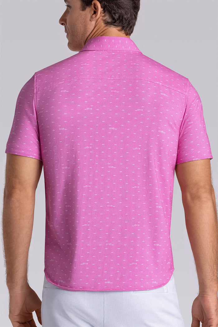 Model wearing Drift Fuchsia Red short sleeve car print shirt, styled with white shorts