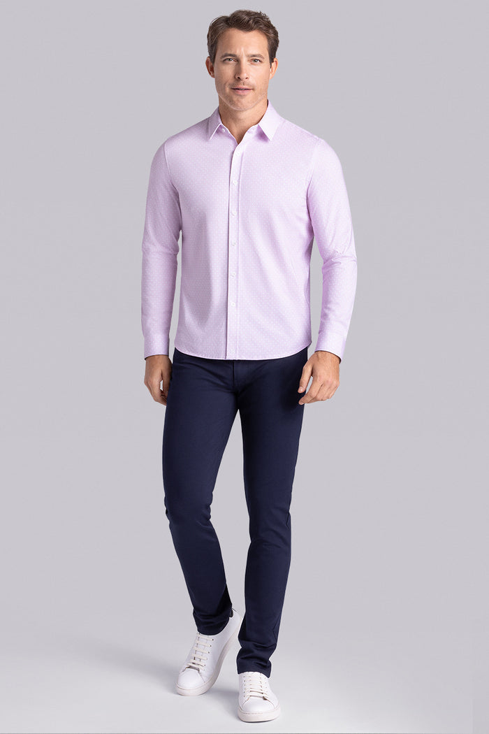 Model wearing Echo English Rose long sleeve tonal geometric print shirt, styled with black pants.