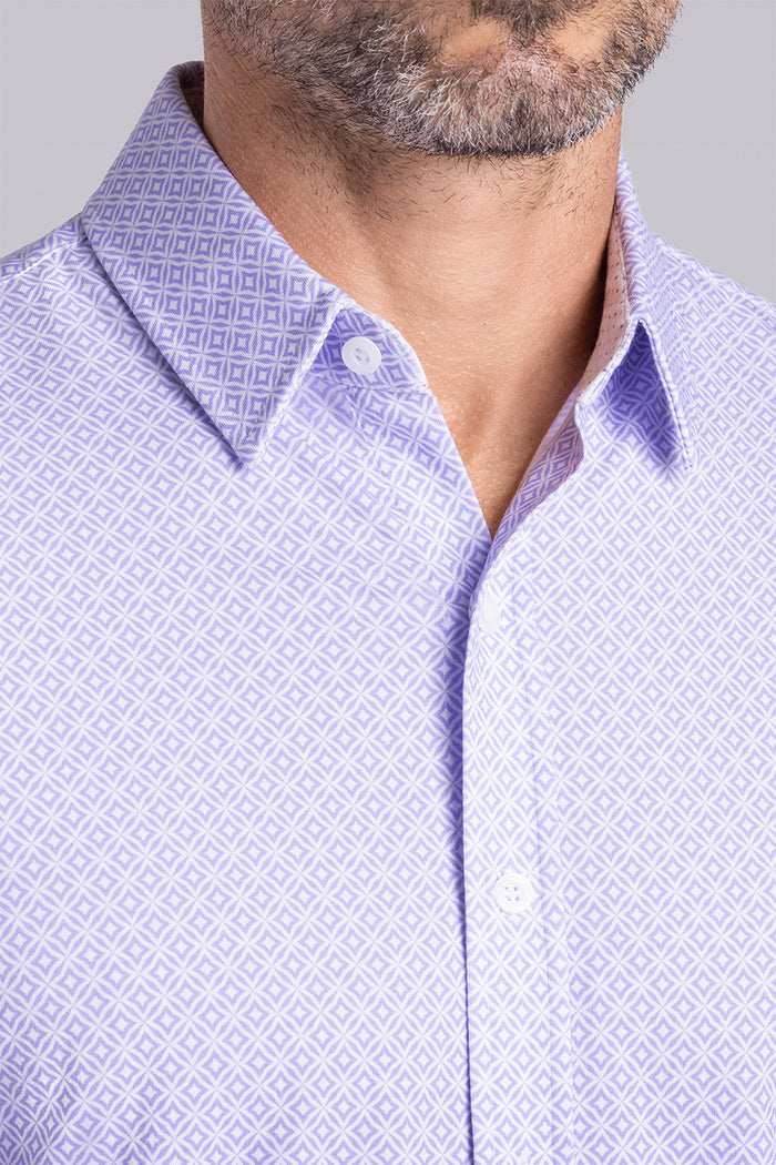 Model wearing Echo Light Purple long sleeve tonal geometric print shirt, styled with black pants.