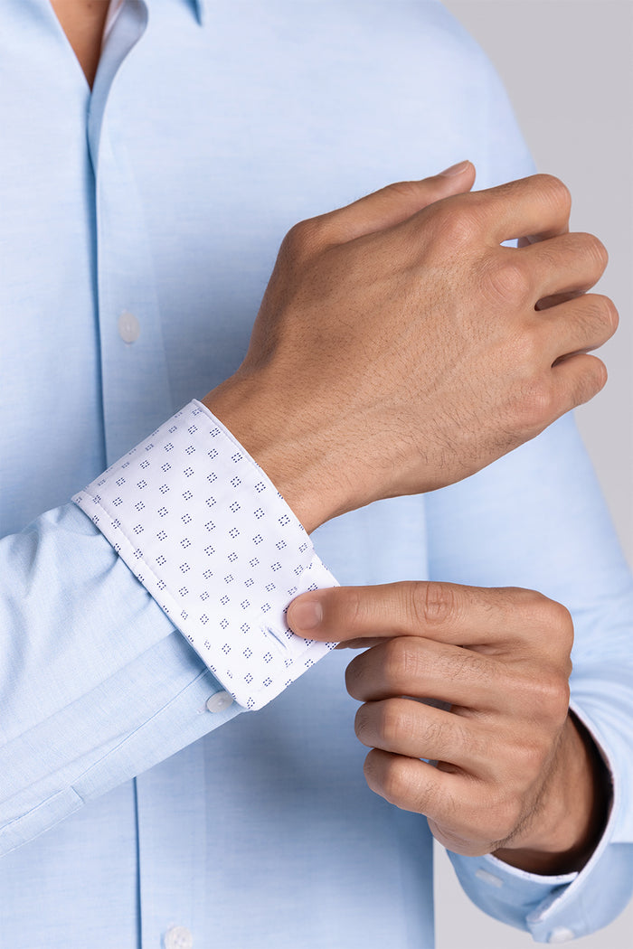 Model wearing the Elusive Seafoam long sleeve dress shirt, styled with fitted black dress slacks.