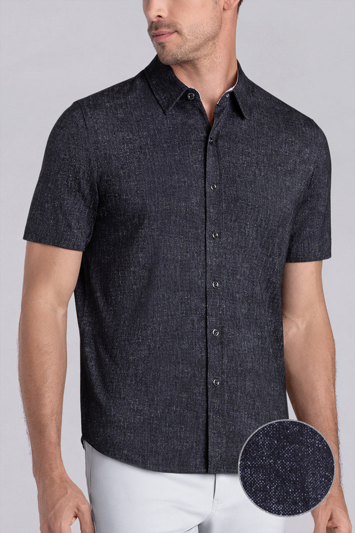 Model wearing Eminent Black short sleeve print shirt, styled with white pants.