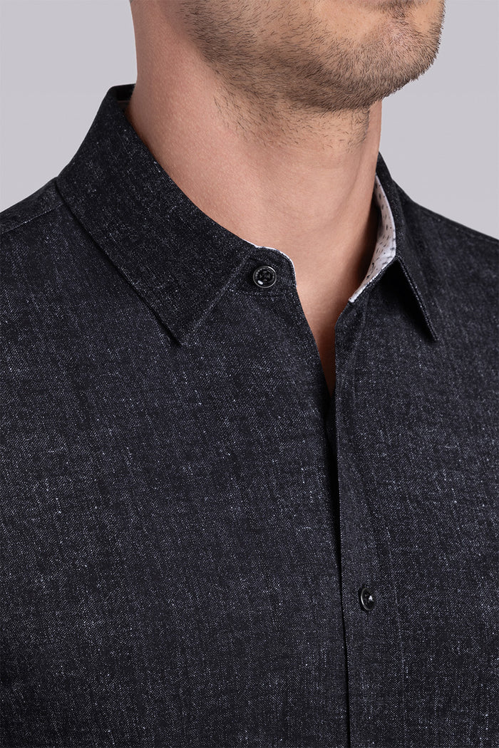 Model wearing Eminent Black short sleeve print shirt, styled with white pants.
