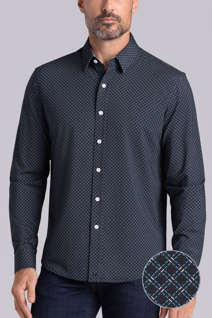 Model wearing Empower Black Green long sleeve dress shirt, styled black pants.