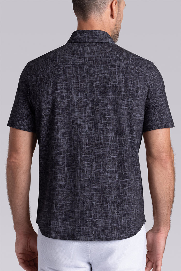 Model wearing Encore Black short sleeve classic collar shirt, style with white shorts