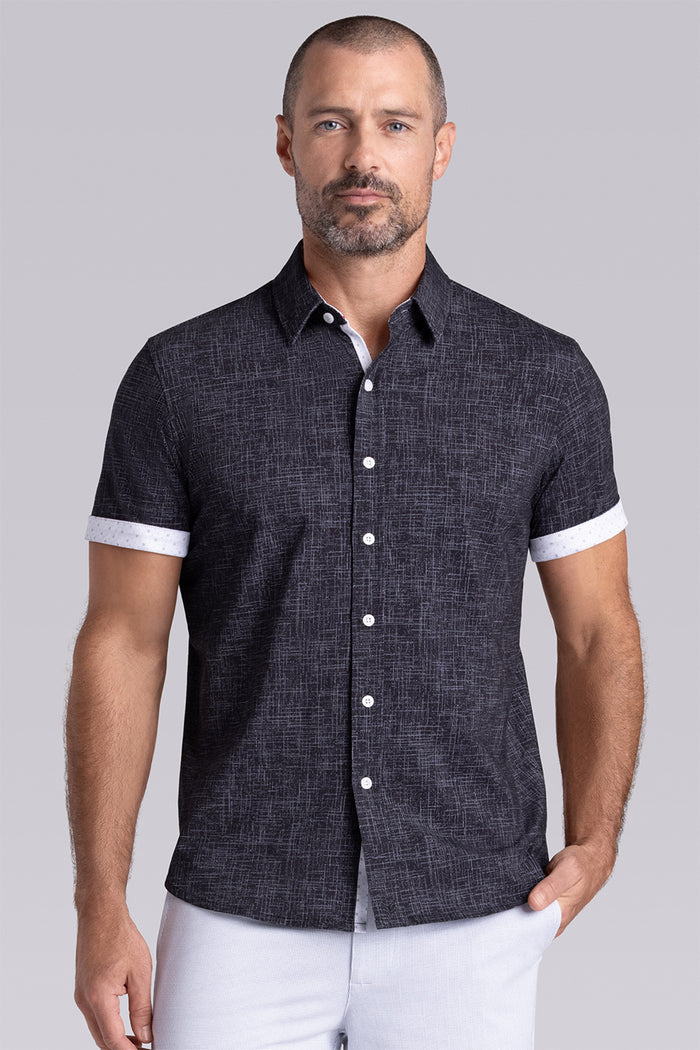 Model wearing Encore Black short sleeve classic collar shirt, style with white shorts