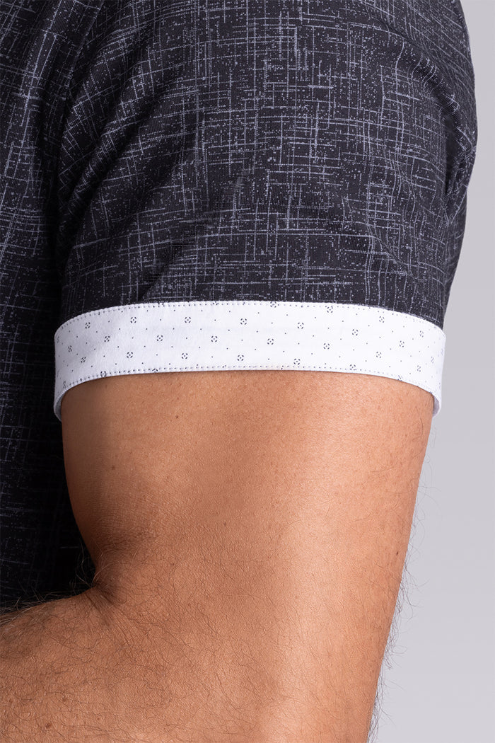 Model wearing Encore Black short sleeve classic collar shirt, style with white shorts