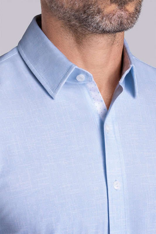 Model wearing Encore Light Blue short sleeve classic collar shirt, style with white shorts