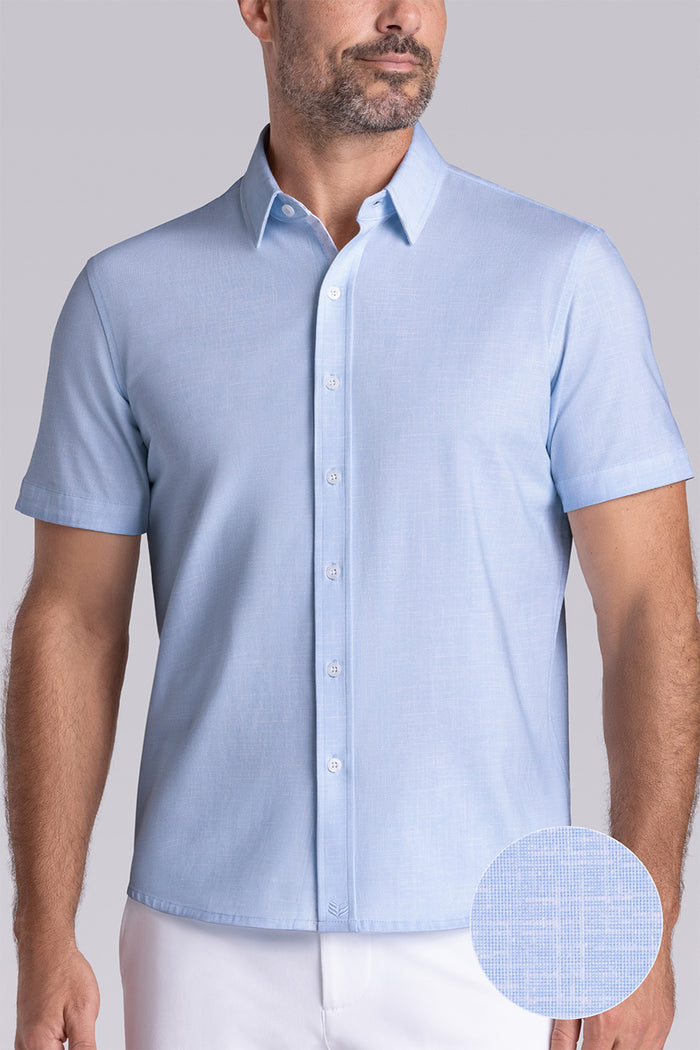 Model wearing Encore Light Blue short sleeve classic collar shirt, style with white shorts