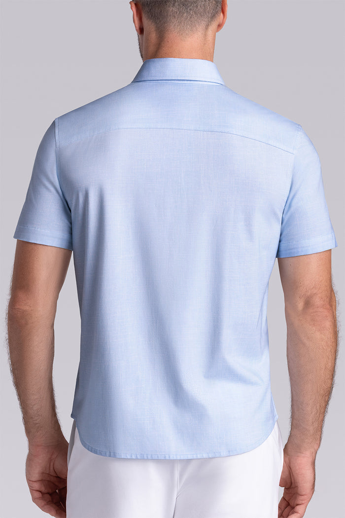 Model wearing Encore Light Blue short sleeve classic collar shirt, style with white shorts