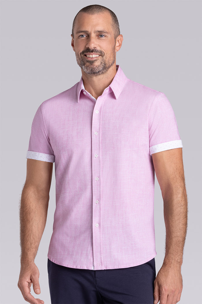 Model wearing Encore Light Pink short sleeve classic collar shirt, style with black shorts