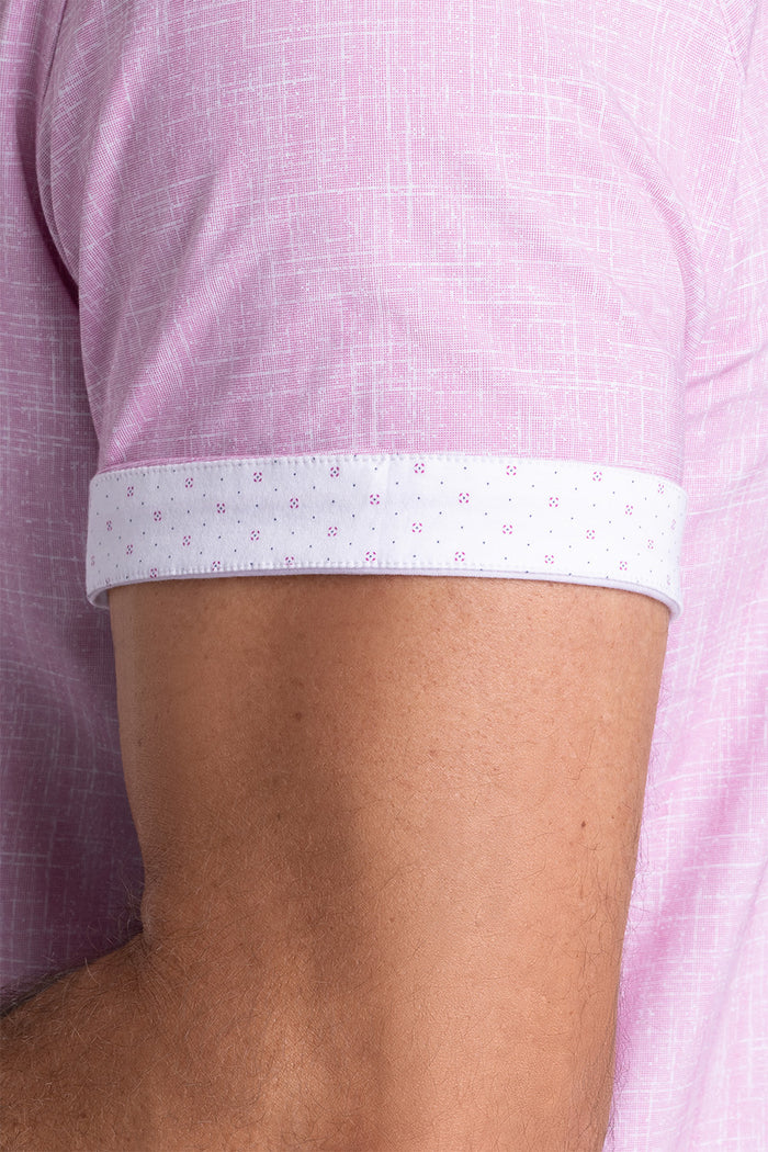 Model wearing Encore Light Pink short sleeve classic collar shirt, style with black shorts