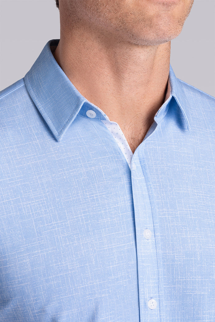 Model wearing Encore Ocean Blue short sleeve classic collar shirt, style with white pants