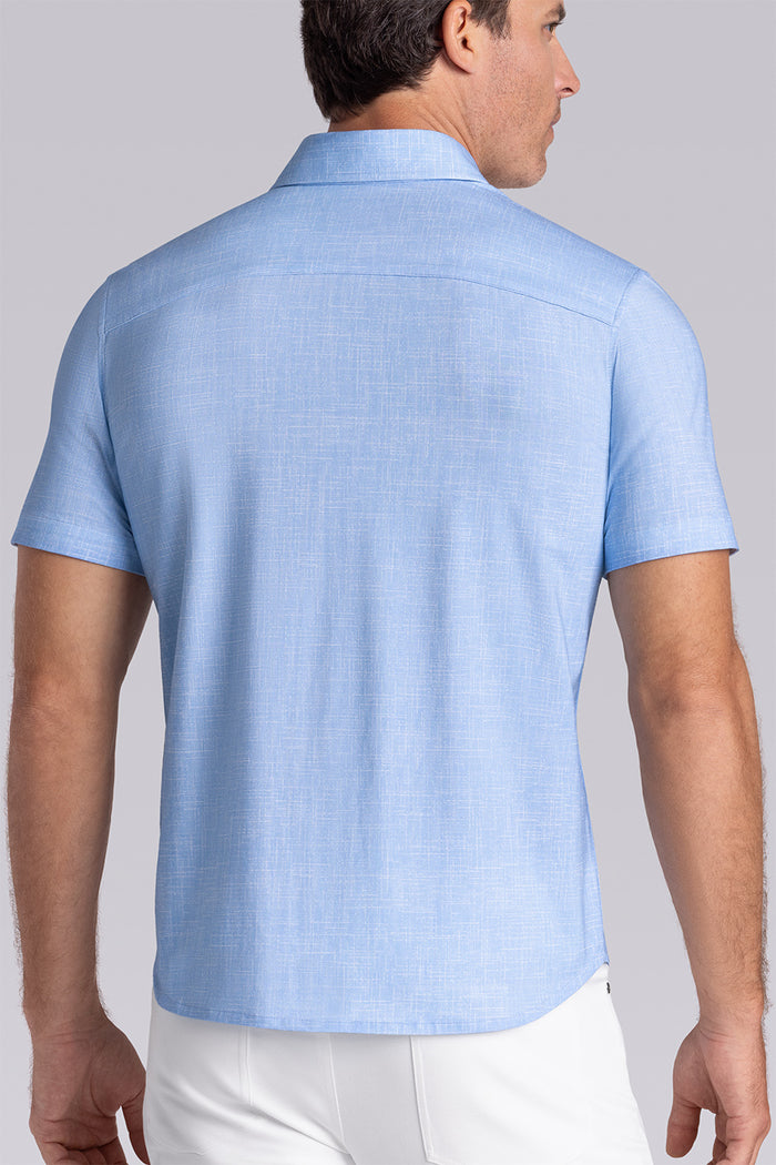 Model wearing Encore Ocean Blue short sleeve classic collar shirt, style with white pants
