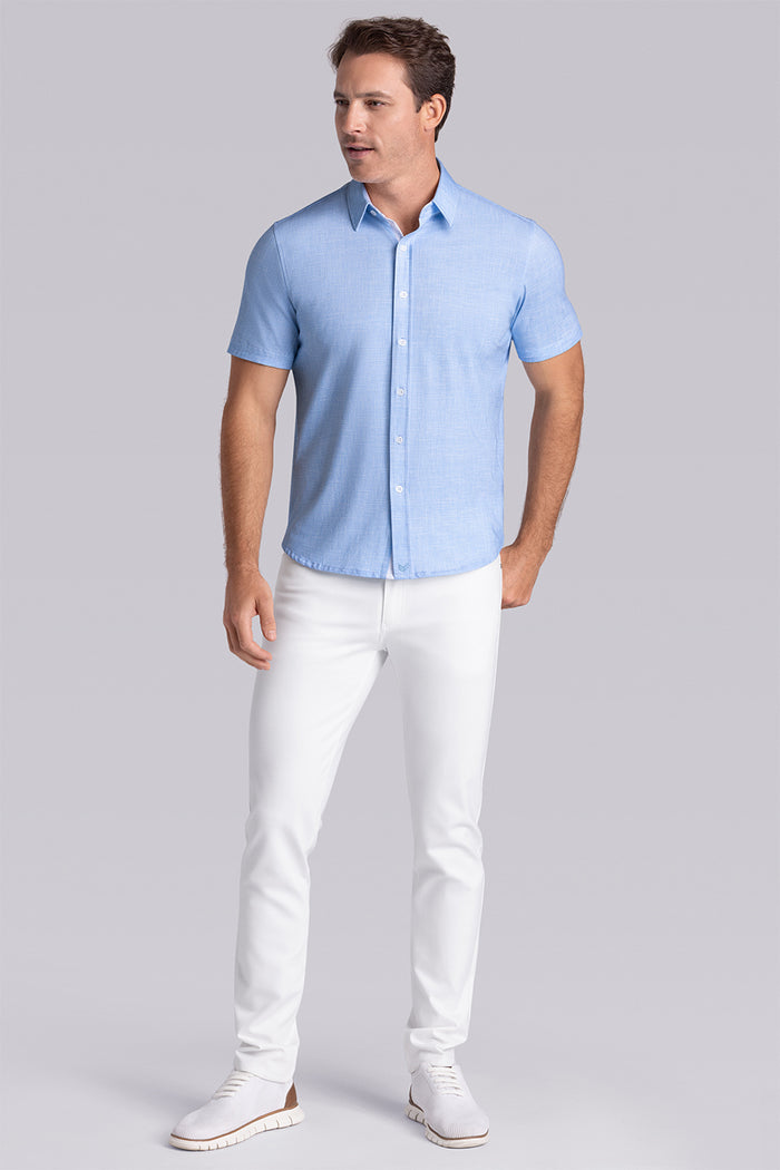 Model wearing Encore Ocean Blue short sleeve classic collar shirt, style with white pants
