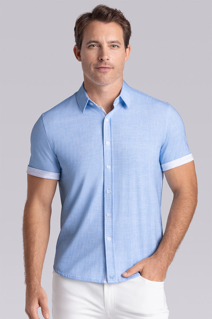 Model wearing Encore Ocean Blue short sleeve classic collar shirt, style with white pants