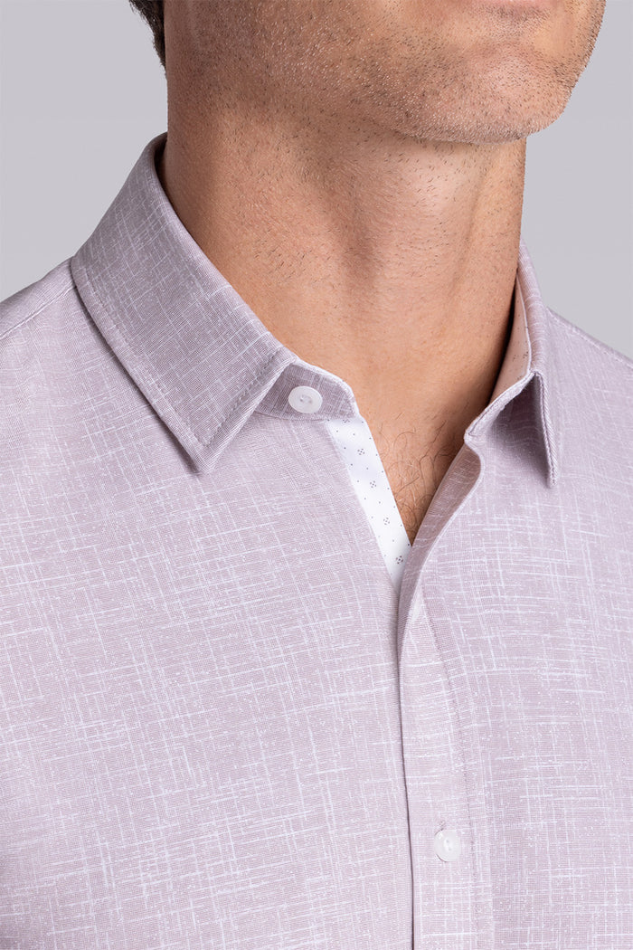 Model wearing Encore Sand short sleeve classic collar shirt, style with white shorts