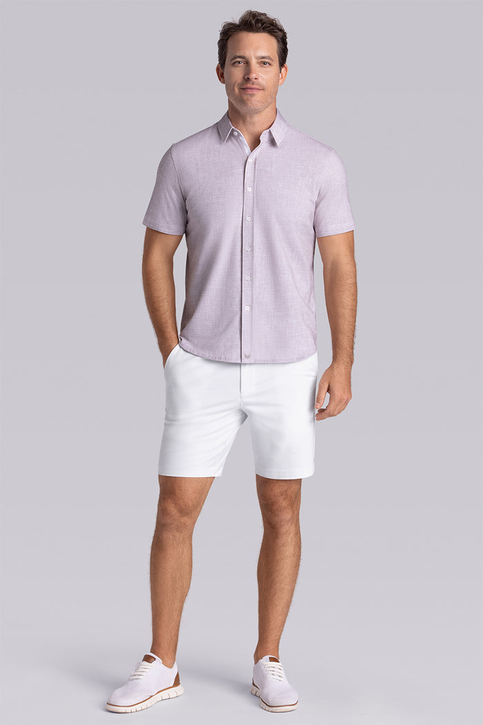 Model wearing Encore Sand short sleeve classic collar shirt, style with white shorts