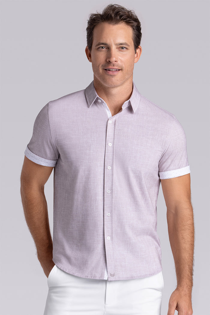 Model wearing Encore Sand short sleeve classic collar shirt, style with white shorts